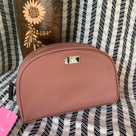 kate spade Handbags - Medium dawn cosmetic Kate spade sparrow new